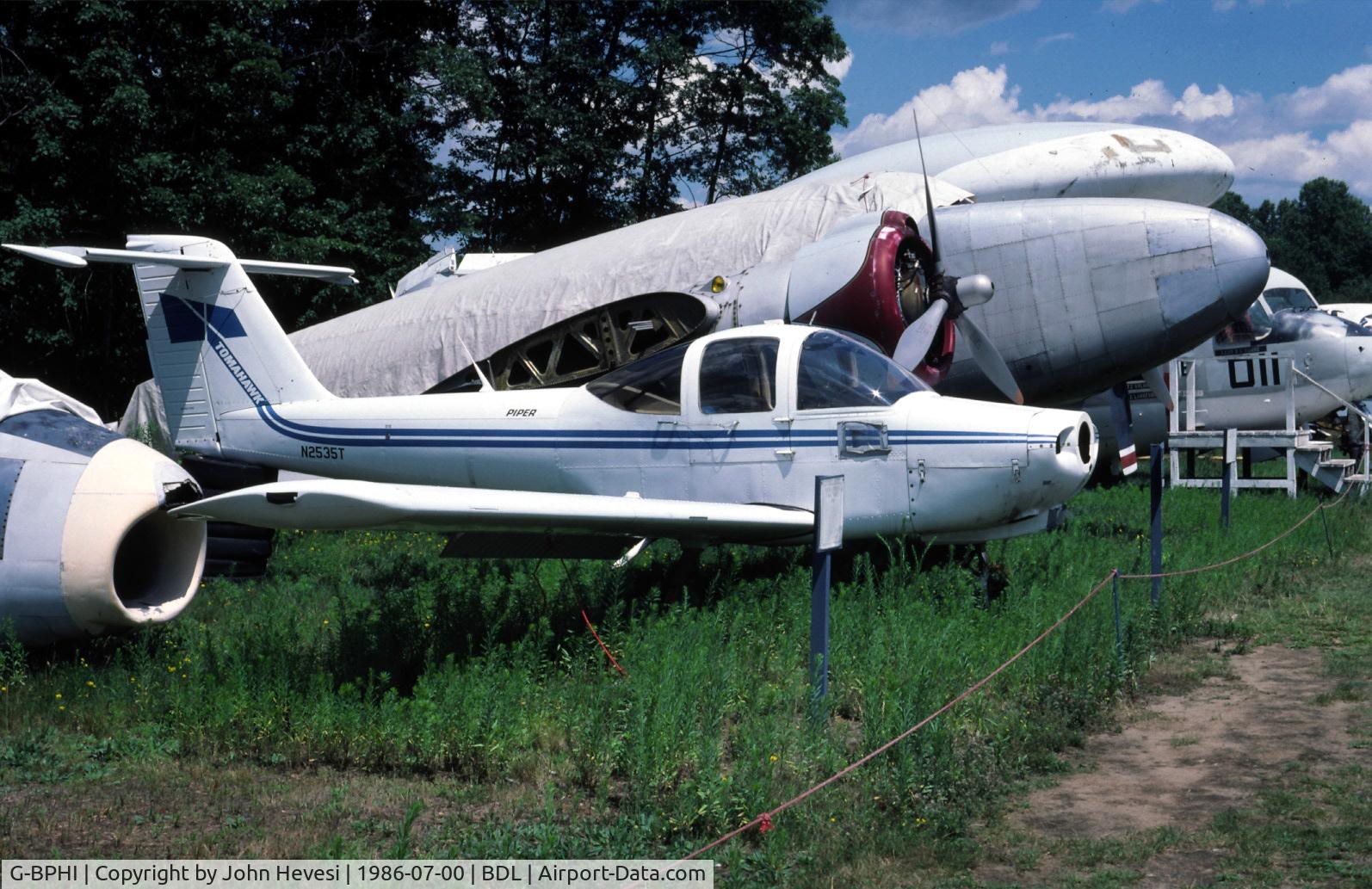 G-BPHI, 1979 Piper PA-38-112 Tomahawk Tomahawk C/N 38-79A0002, G-BPHI wearing its old colors and reg (N2535T) at Bradley Air Museum's (NEAM) Storage yard.