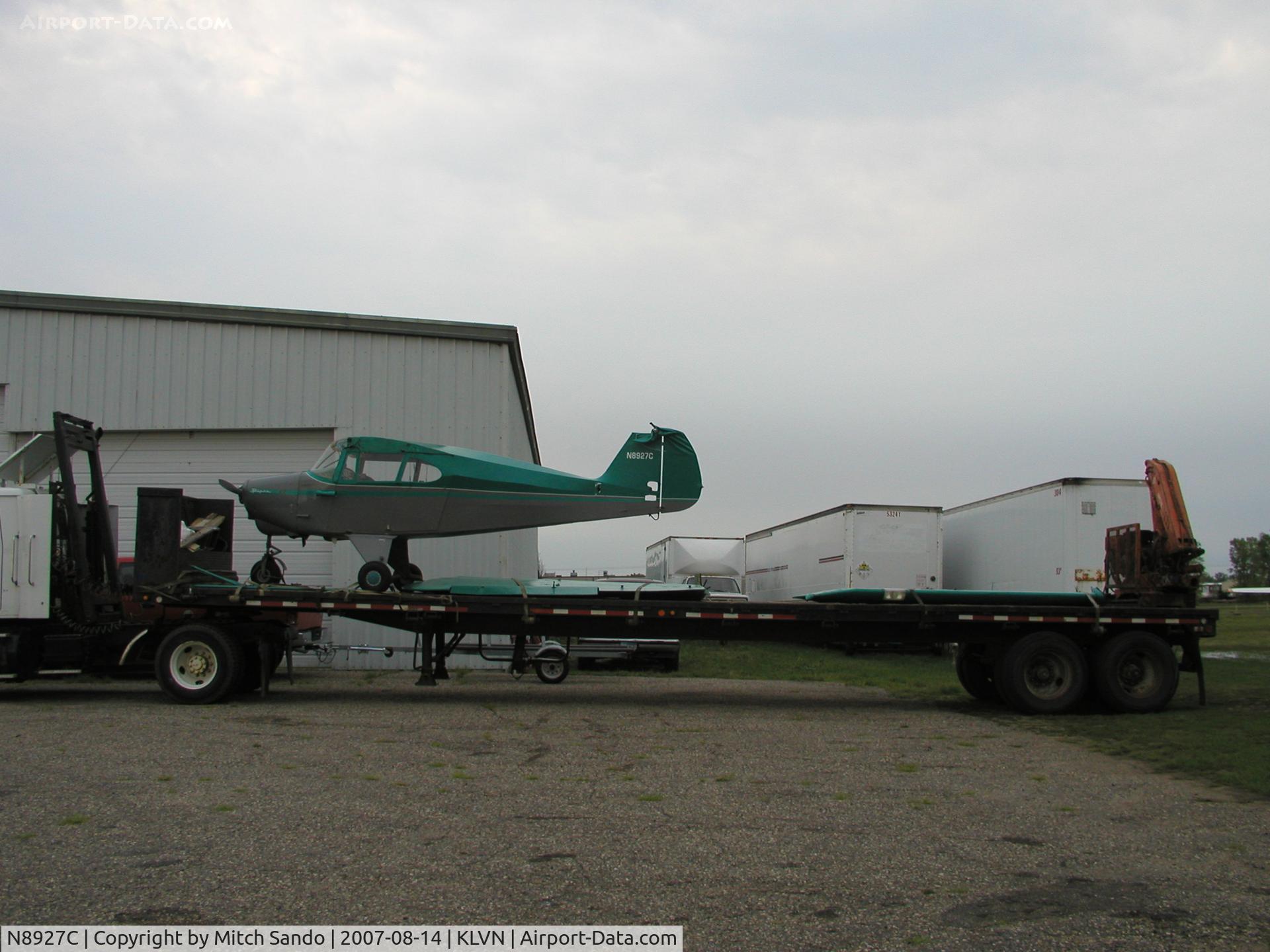 N8927C, 1953 Piper PA-22-135 Tri-Pacer C/N 22-1523, Sitting on a flat bed trailer from Flying Cloud after 70MPH winds blew it over in a severe storm.