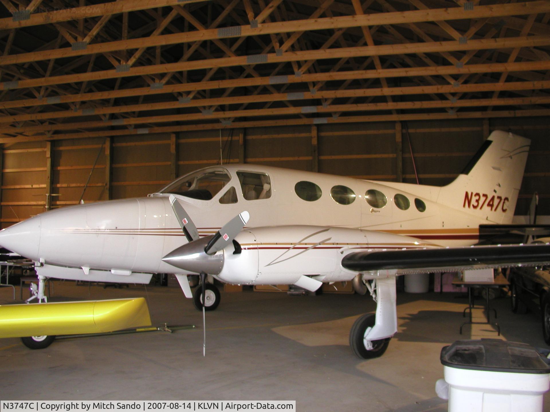 N3747C, 1975 Cessna 414 Chancellor C/N 414-0818, Cessna 414 parked inside it's hangar.