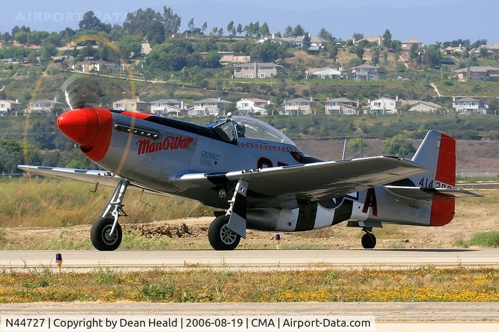 N44727, 1944 North American P-51D Mustang C/N 122-39198, 1944 North American P-51D N44727 'Man O'War' taxiing prior to her performance at the 2006 EAA Camarillo Airshow.  (1/50 sec)  Backlit, but still cool.