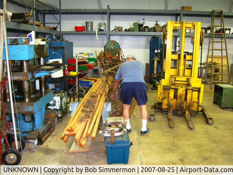 UNKNOWN, , That's Sam's hind-end.  He's checking out the wings from the 1940 Porterfield.  Don't stare at his legs.