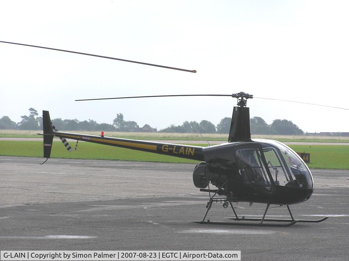 G-LAIN, 1991 Robinson R22 Beta C/N 1992, R22 on a grey day at Cranfield
