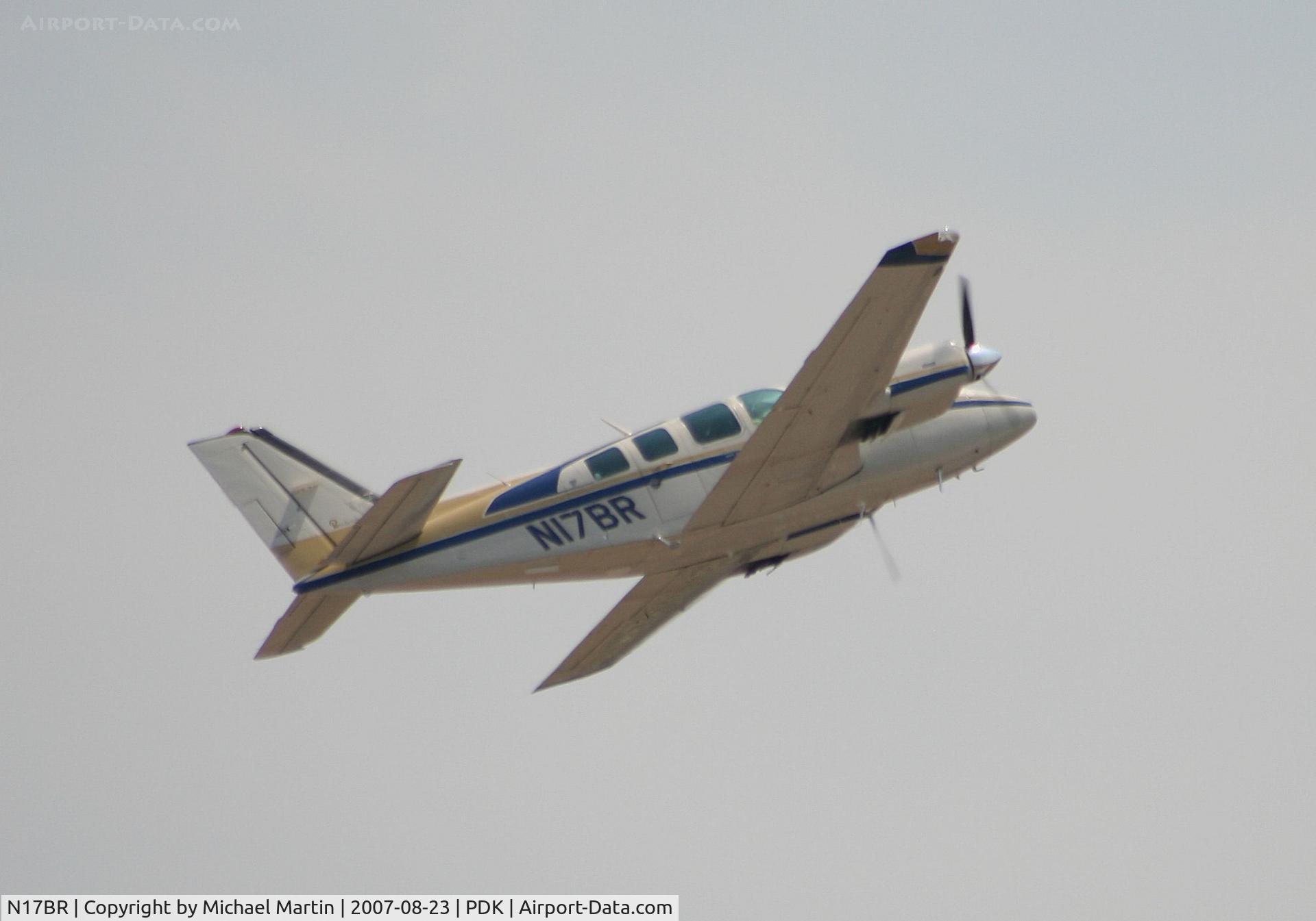 N17BR, 1983 Beech 58 Baron C/N TH-1372, Climbing hard out of PDK