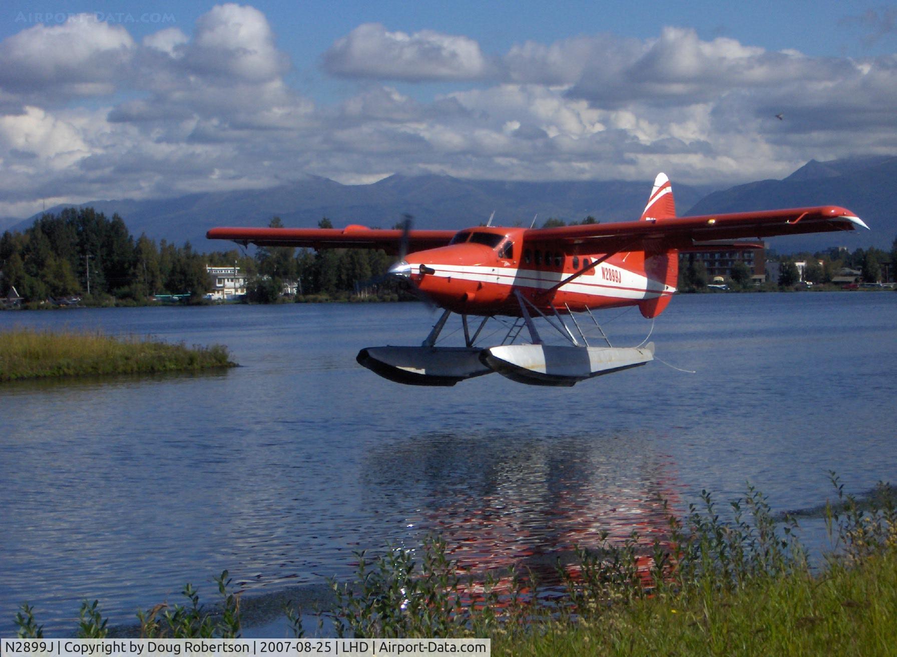 N2899J, 1961 De Havilland Canada DHC-3 Turbo Otter C/N 425, 1961 DeHavilland OTTER DHC-3, P&W-C PT6A 675 shp turboprop conversion from P&W R-1340 600 Hp radial, of Rust Air, restricted class, landing. Fortuitous artistic shot.