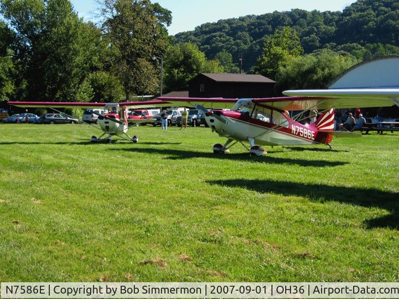 N7586E, 1958 Champion 7EC C/N 7EC-680, Parked beside it's 7FC Tri-Champ mate (N7543E) at the breakfast fly-in at Zanesville, OH (Riverside)