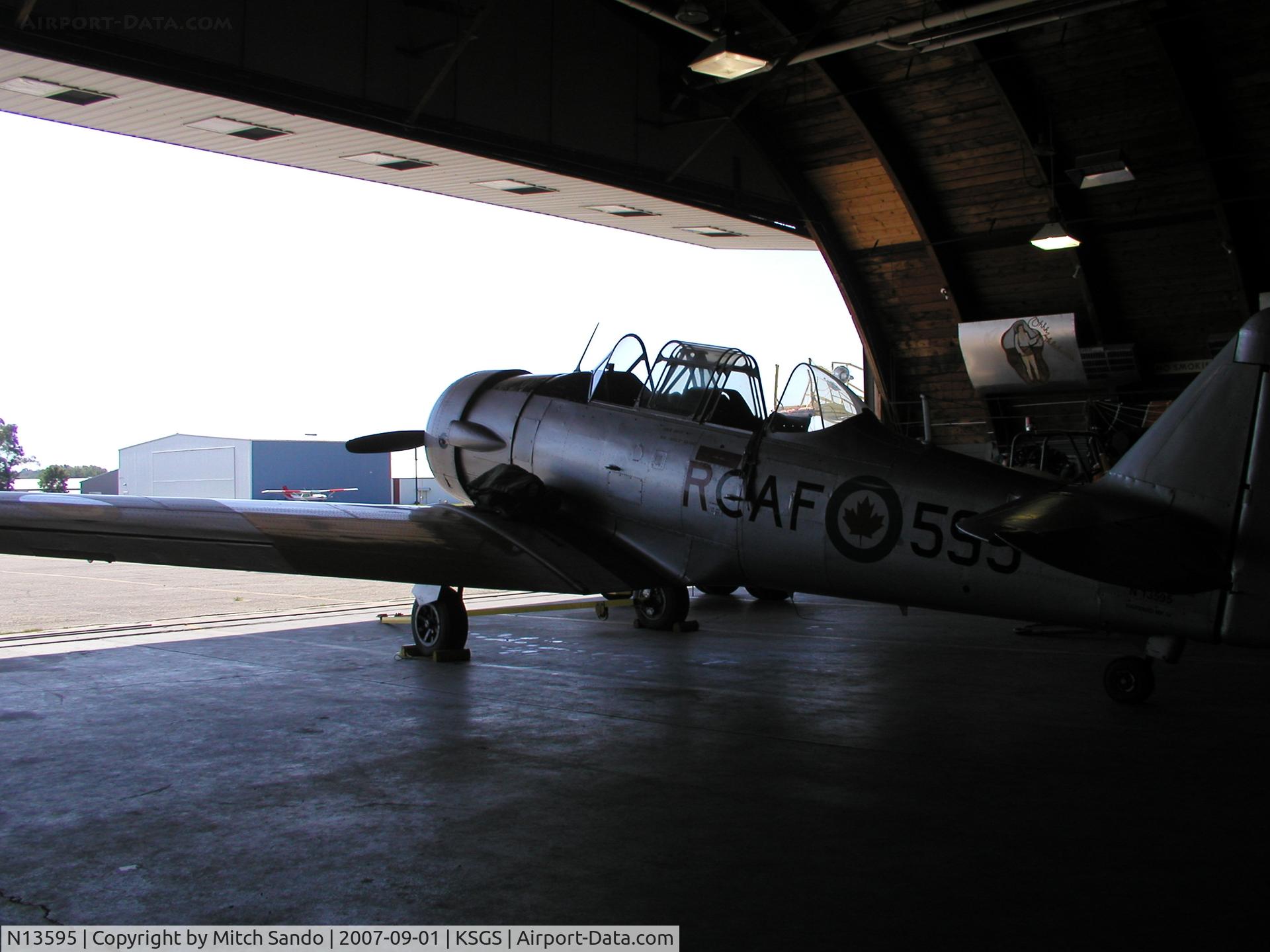 N13595, 1952 Canadian Car & Foundry T-6 Harvard Mk.4 C/N CCF4-97, Parked inside the Commemorative Air Force Hangar.