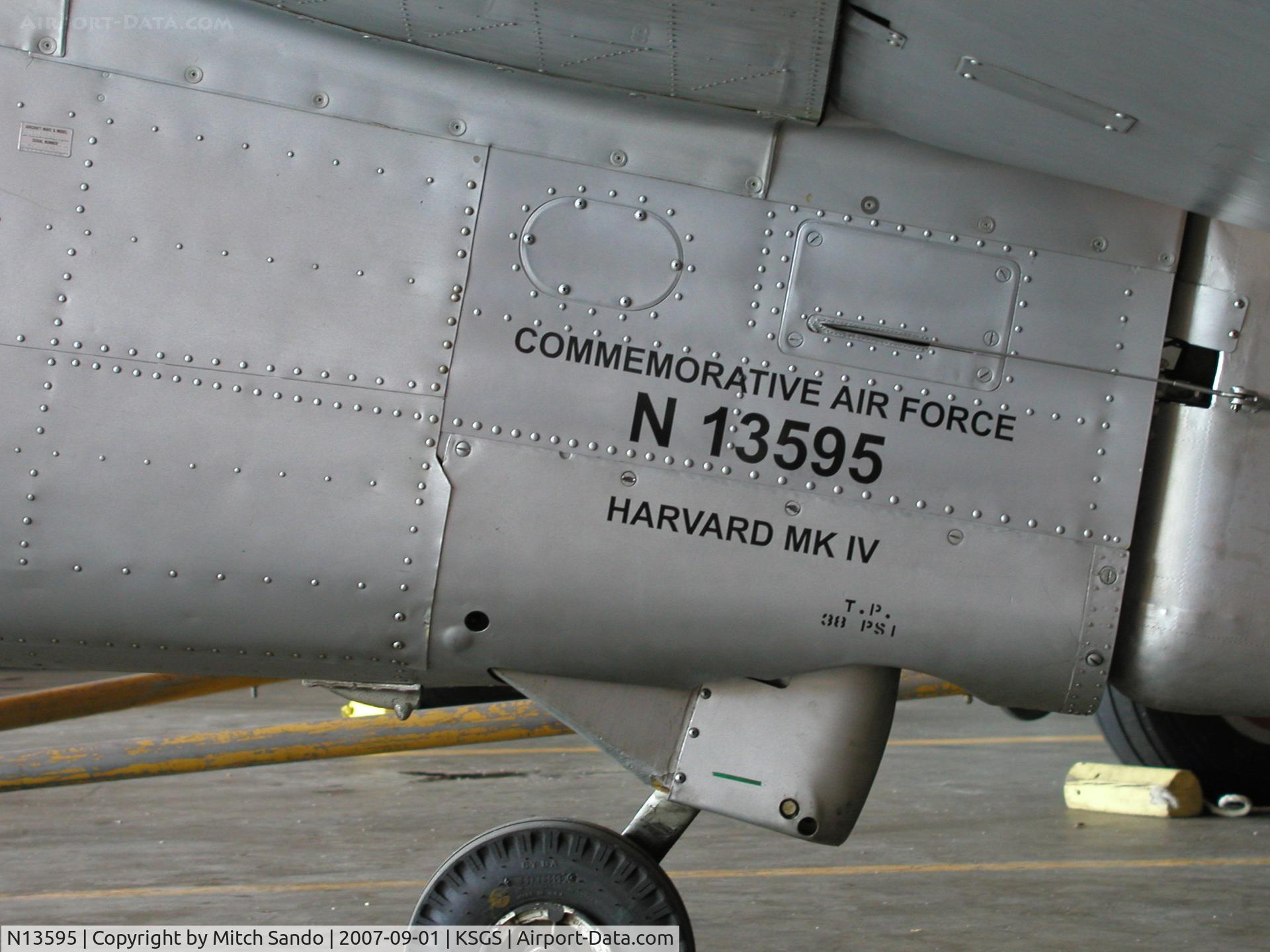 N13595, 1952 Canadian Car & Foundry T-6 Harvard Mk.4 C/N CCF4-97, Parked inside the Commemorative Air Force Hangar.