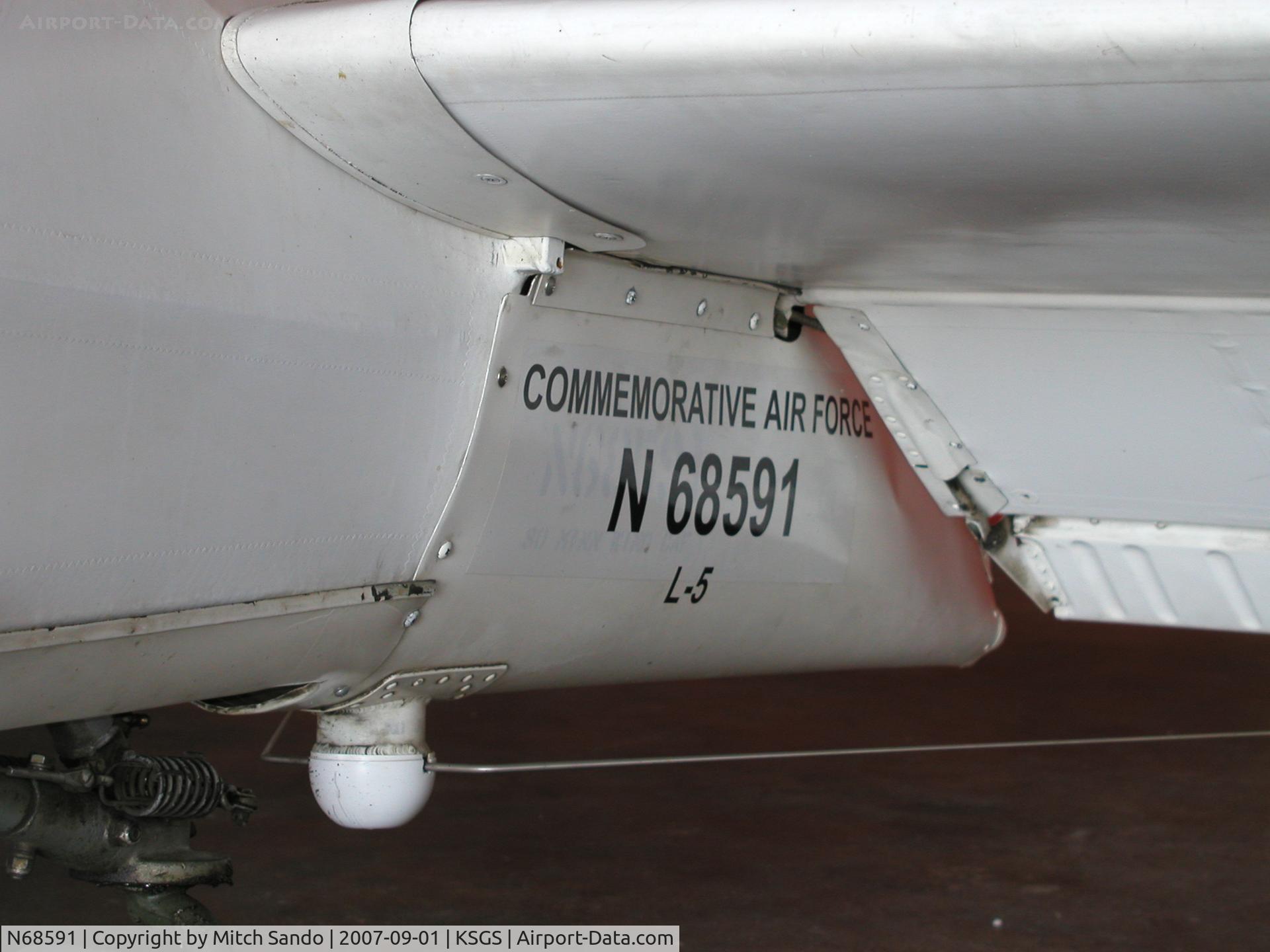 N68591, Stinson L-5 Sentinel C/N 42-98667 (76-908), Parked inside the Commemorative Air Force Hangar.