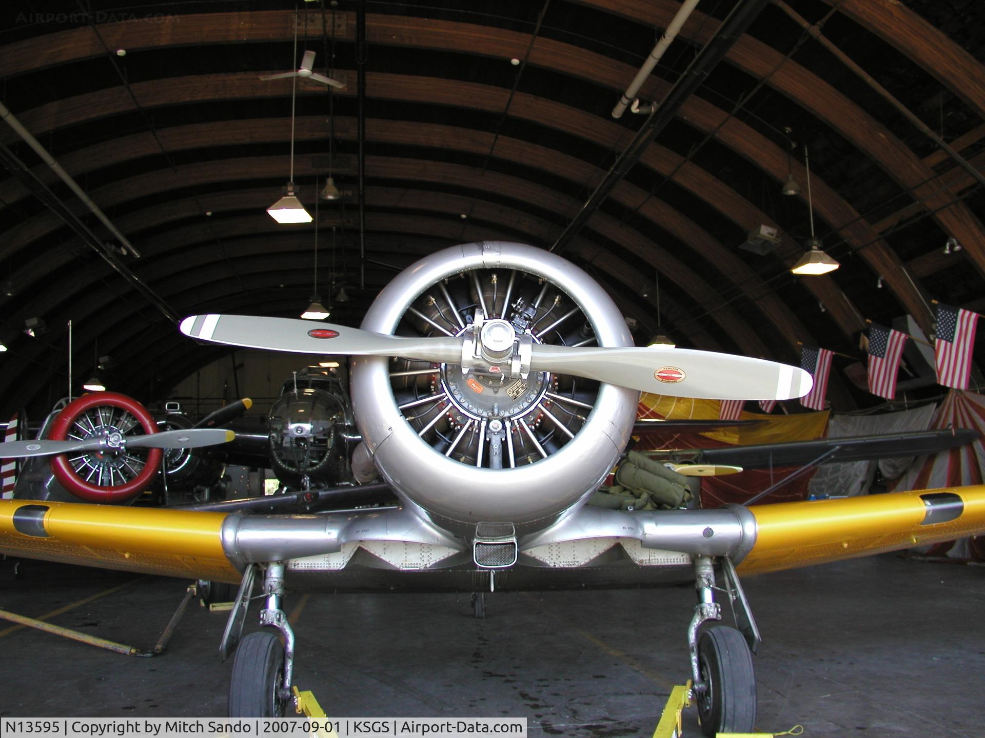 N13595, 1952 Canadian Car & Foundry T-6 Harvard Mk.4 C/N CCF4-97, Parked inside the Commemorative Air Force Hangar.