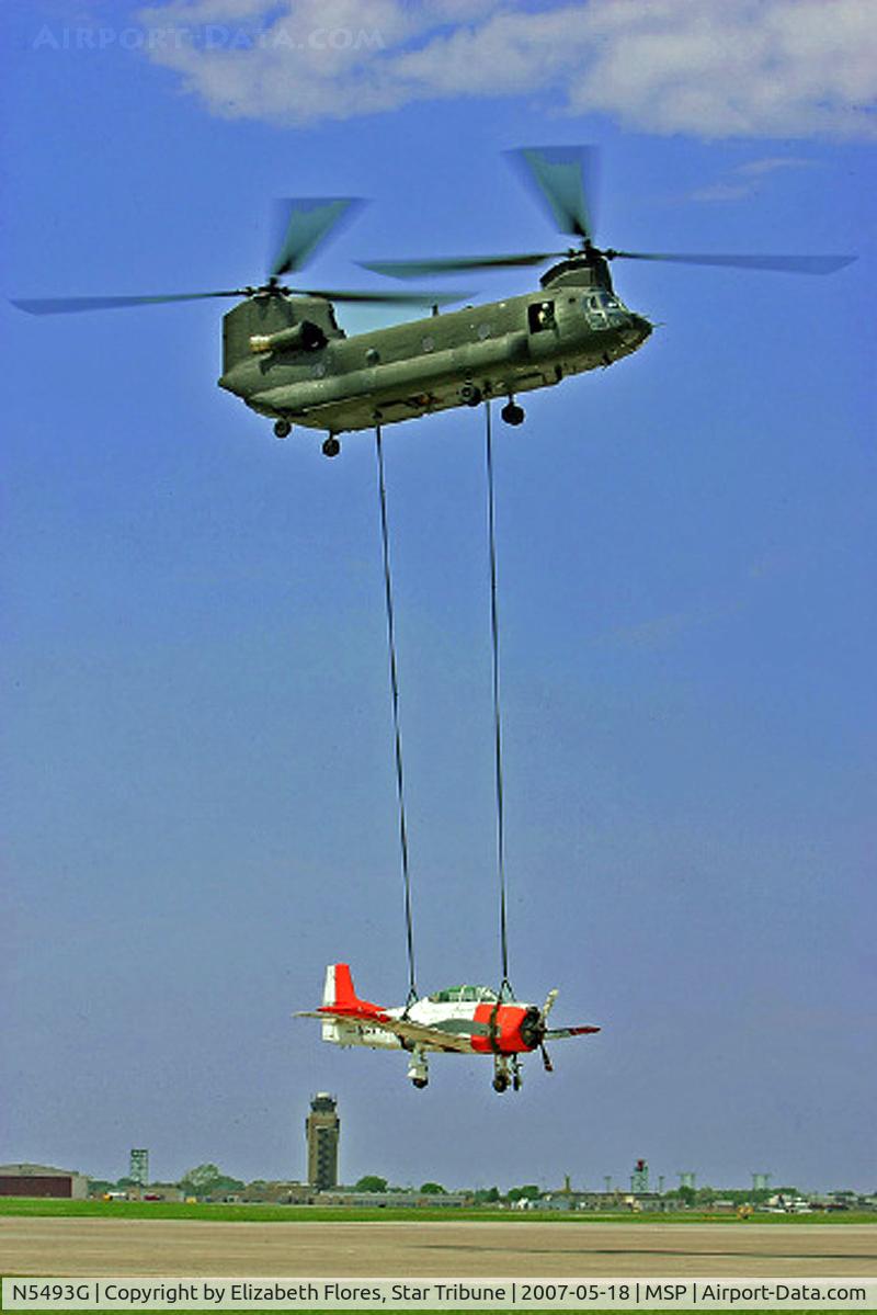 N5493G, North American T-28B C/N 138206, A Chinook helicopter carried a 1950's T-28 plane to the 133 Airlift Wing Minnesota Air National Guard landing pad. The plane, which was flown to St. Paul from Pennsylvania, will be placed in the Minnesota Air Guard Museum.