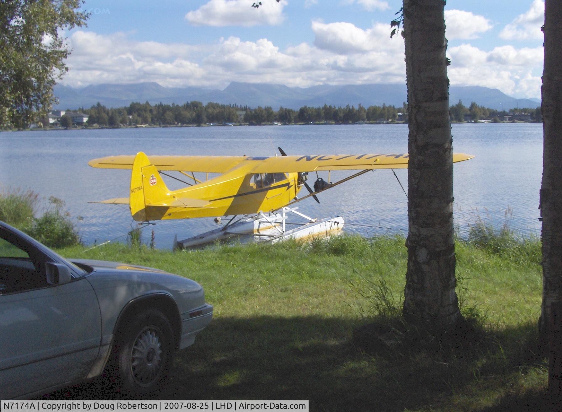 N7174A, 1940 Piper J3F-65 C/N 5908, as NC7174A 1940 Piper J3F-65 CUB, Continental C90 90Hp upgrade from original Franklin 4AC-176B 65 Hp, a rara avis, Note: rod/gun case carried on struts