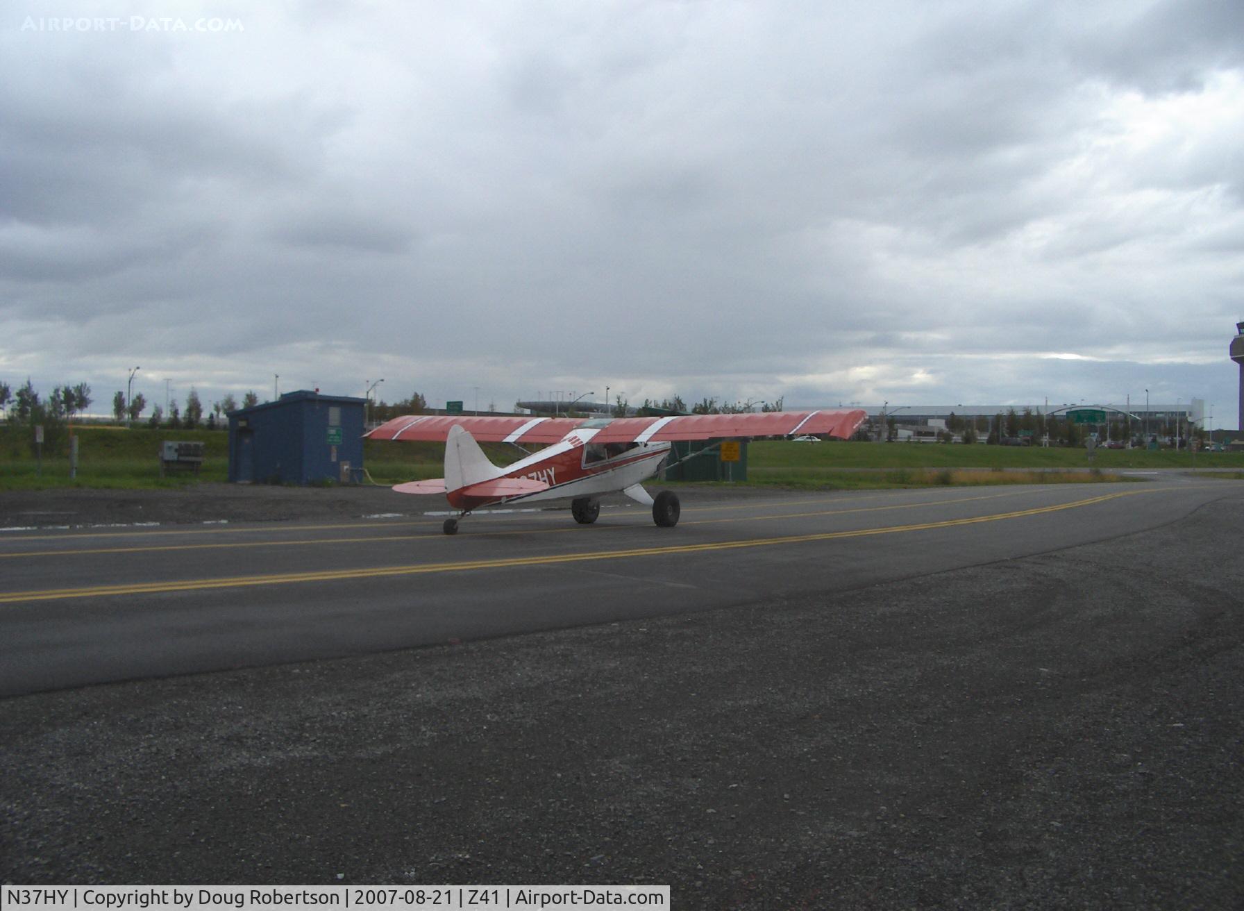 N37HY, 1999 Aviat A-1B Husky C/N 2037, 1999 Aviat HUSKY A-1B, Lycoming O-360-A1D 180 Hp, 4 psi tundra tires, wing extensions, taxi to Z41. BIG THANKs to Friend Timothy Aanerud for the positive ID. I owe you another supper!