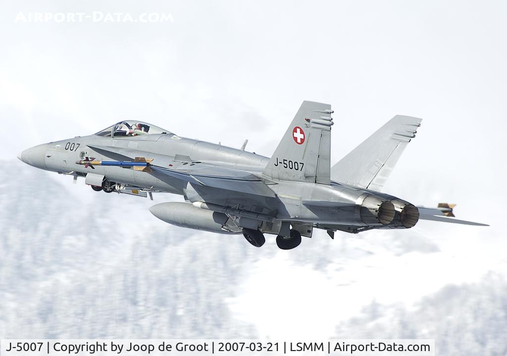 J-5007, McDonnell Douglas F/A-18C Hornet C/N 1335/SFC007, Flying if front of a typical white out due to fresh fallen snow.
