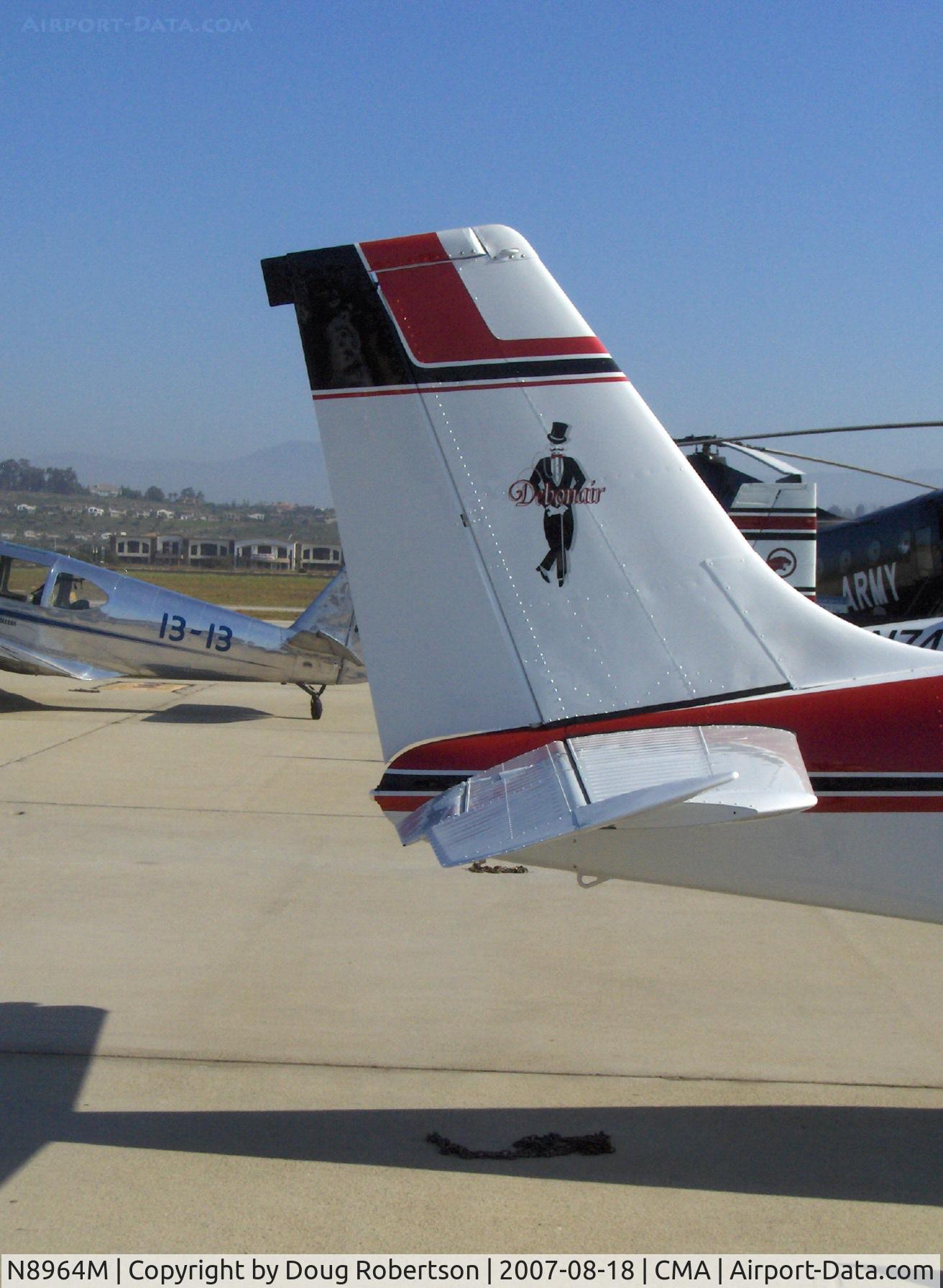 N8964M, 1963 Beech 35-B33 Debonair C/N CD-720, 1963 Beech 35 B33 DEBONAIR, Continental IO-470-K 225 Hp, Mr. Debonair's tail art