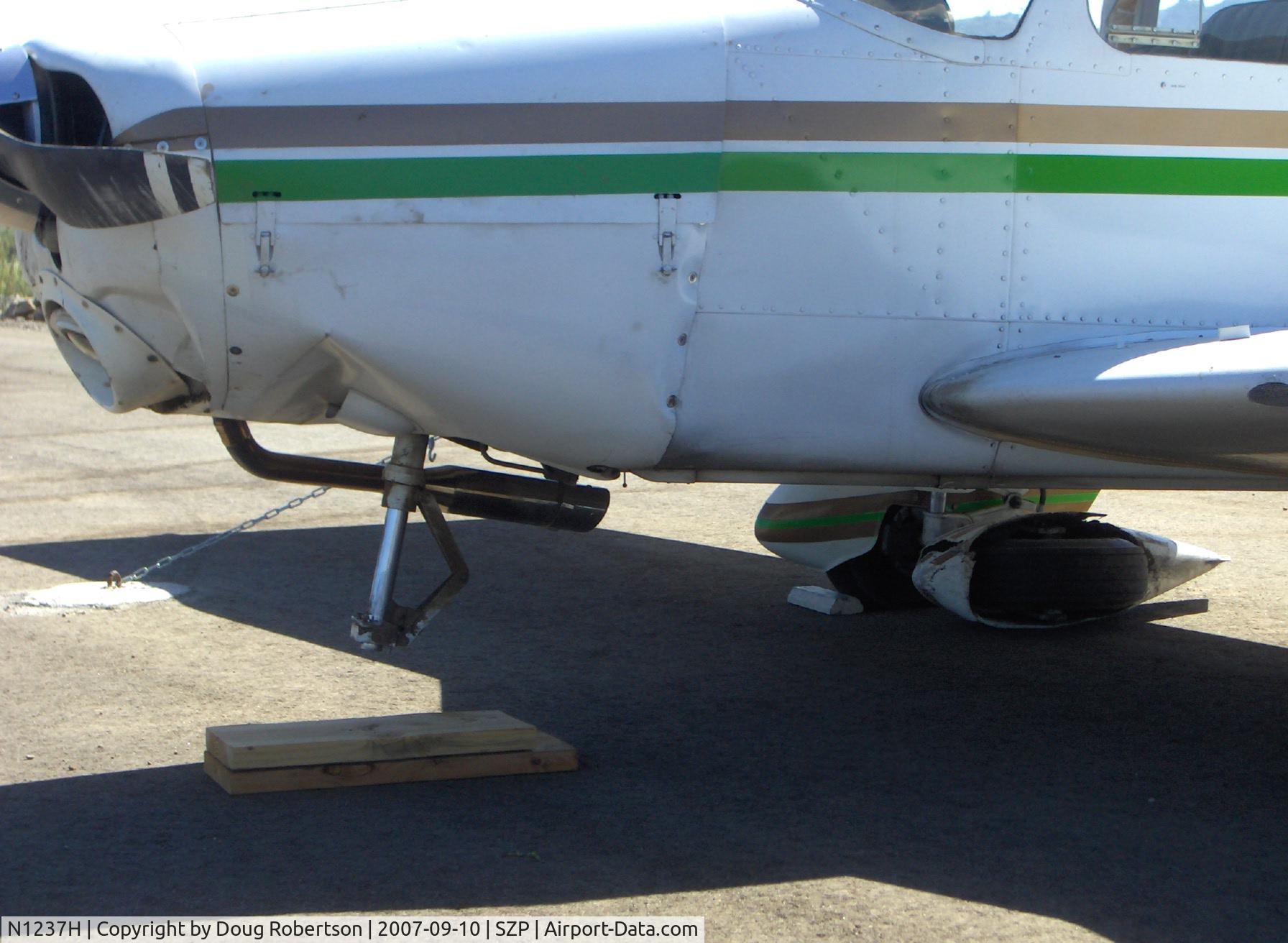 N1237H, Piper PA-28-140 Cruiser C/N 28-7725137, 1976 Piper PA-28-140 CRUISER, Lycoming O-320-E3D 150 Hp, landed hard & long on Rwy 22-bounced twice-overran end and crashed into dirt berm, aircraft totaled by Insurance Co., landing gear, spinner, prop, wings, fuselage damage, nose wheel sheared