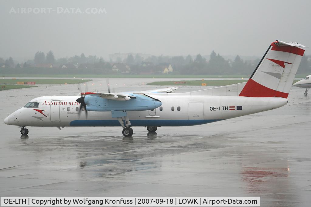 OE-LTH, 1997 De Havilland Canada DHC-8-314Q Dash 8 C/N 442, rainy day @ KLU