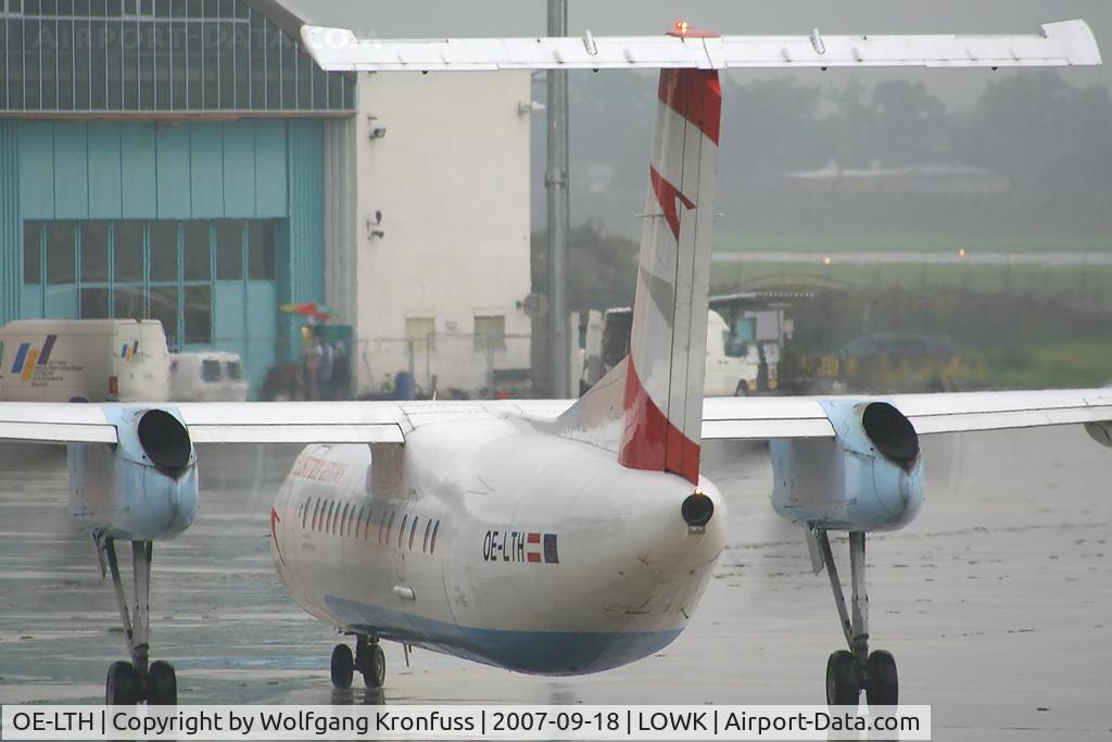 OE-LTH, 1997 De Havilland Canada DHC-8-314Q Dash 8 C/N 442, rainy day @ KLU