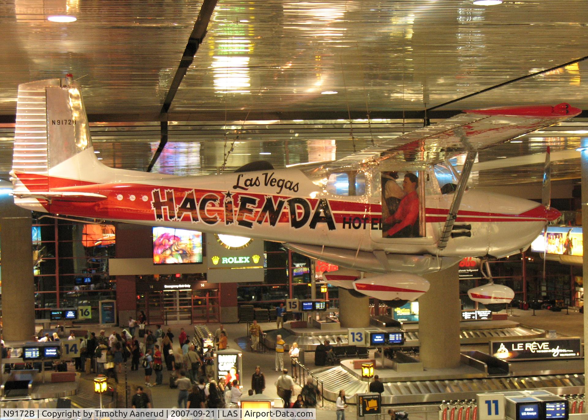 N9172B, 1958 Cessna 172 C/N 36772, 1958 Cessna 172 Skyhawk, c/n 36772, Hanging over the baggage claim area.  Set endurance record of 62 days 19 minutes 5 seconds