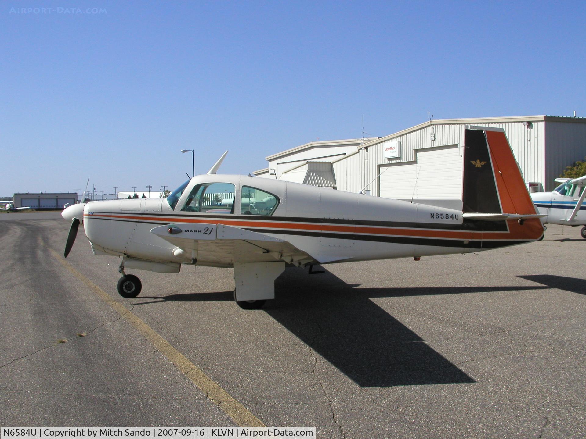 N6584U, 1962 Mooney M20C Ranger C/N 2366, Parked on the ramp at Airlake.