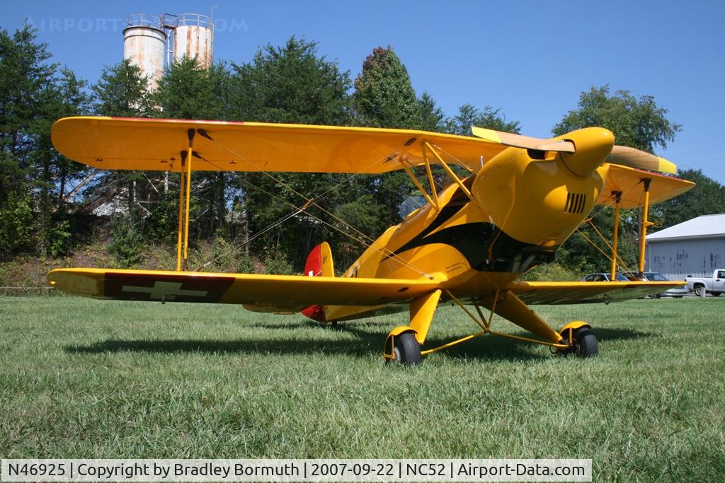 N46925, 1951 CASA 1-131E Jungmann C/N Not found E3B-461/N46925, The yellow and red paint contrasts very well with the grass.