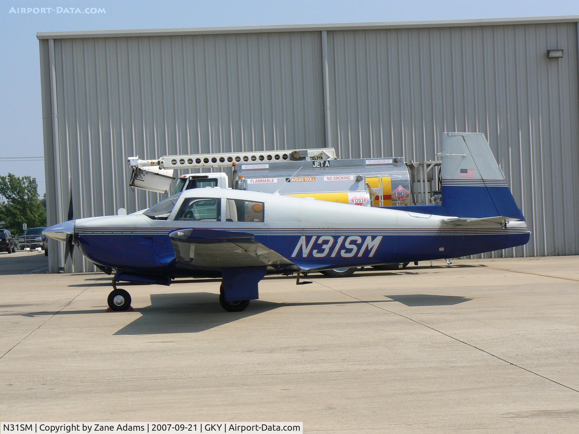 N31SM, 1965 Mooney M20E C/N 635, on the ramp at Arlington Muni