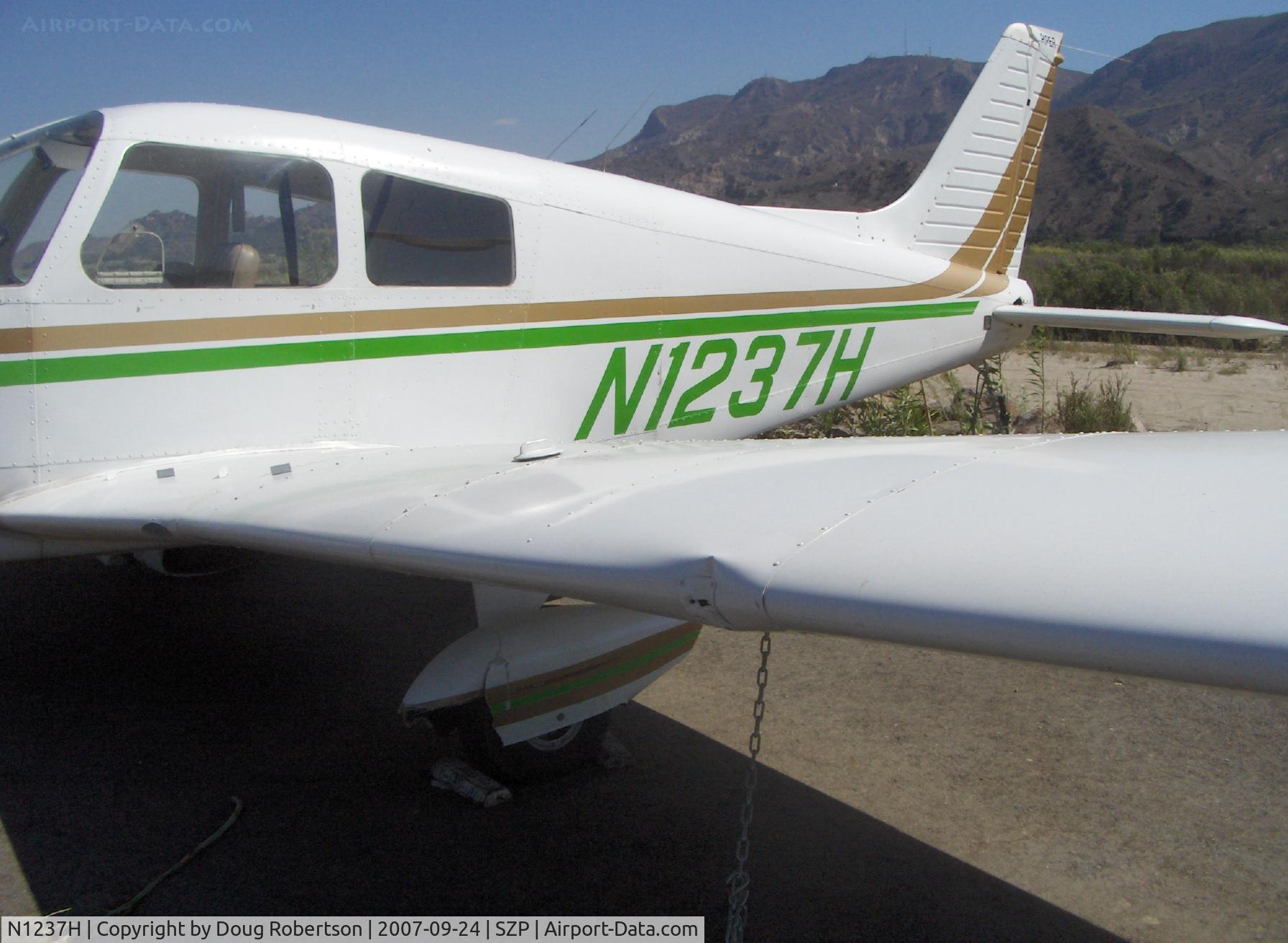 N1237H, Piper PA-28-140 Cruiser C/N 28-7725137, 1976 Piper PA-28-140 CRUISER, Lycoming O-320-E3D 150 Hp, landed long on Rwy 22-overran end and crashed into fence & dirt berm, aircraft totaled by Insurance Co., landing gear, prop, wing dents, fuselage damage, spinner dents