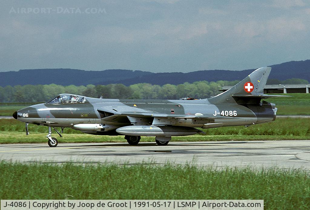 J-4086, 1960 Hawker Hunter F.58 C/N 41H-697453, Just before the thunderstorm started this Hunter came in for landing.