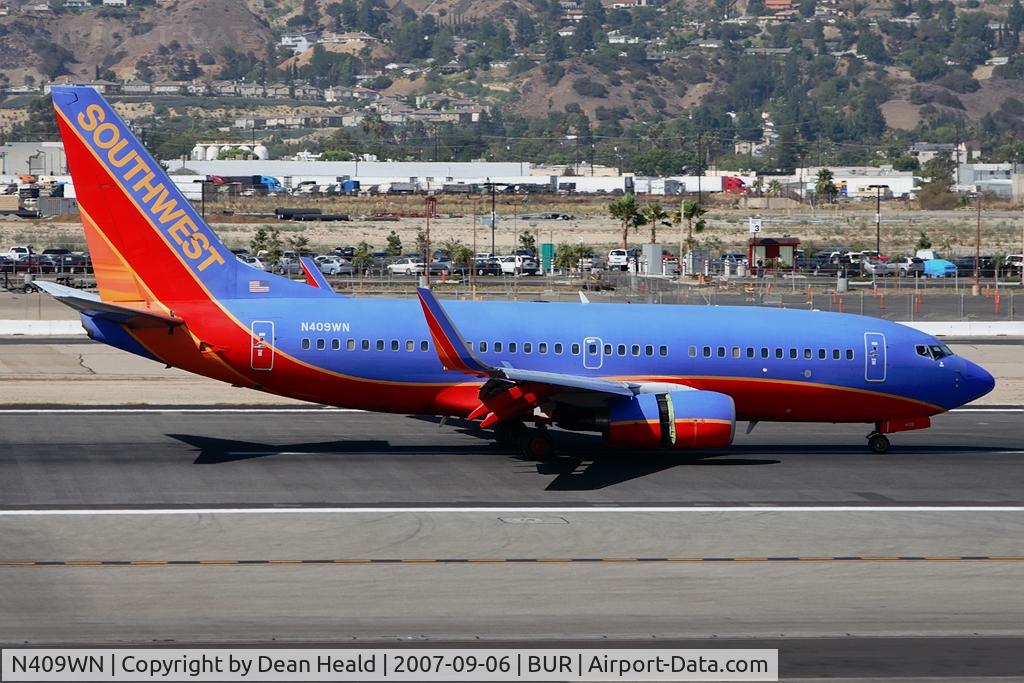 N409WN, 2001 Boeing 737-7H4 C/N 27896, Southwest Airlines N409WN (FLT SWA1030) from Metropolitan Oakland Int'l (KOAK) concluding her landing rollout on RWY 8.