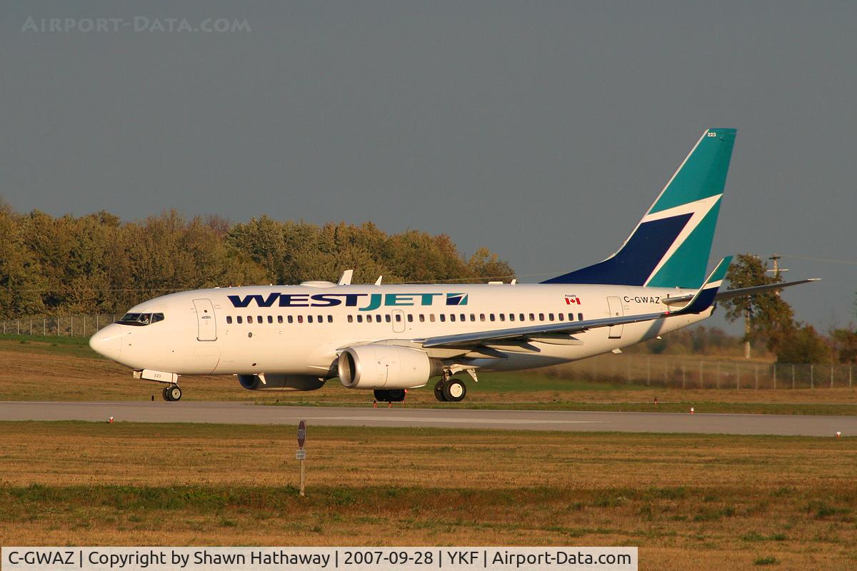 C-GWAZ, 2004 Boeing 737-7CT C/N 32763, Taixing on to runway 25, Flight to Calgary From Waterloo Onatrio Canada