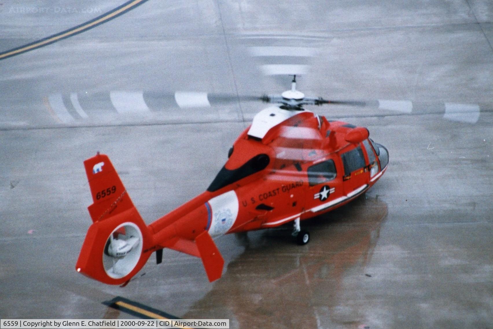 6559, 1987 Aerospatiale HH-65C Dolphin C/N 6241, HH-65B below the control tower - a quick stop in and out