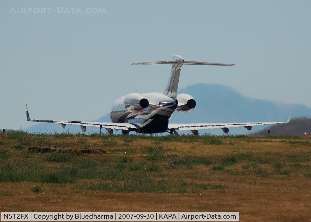 N512FX, 2004 Bombardier Challenger 300 (BD-100-1A10) C/N 20022, Takeoff with Pike's peak in the background.