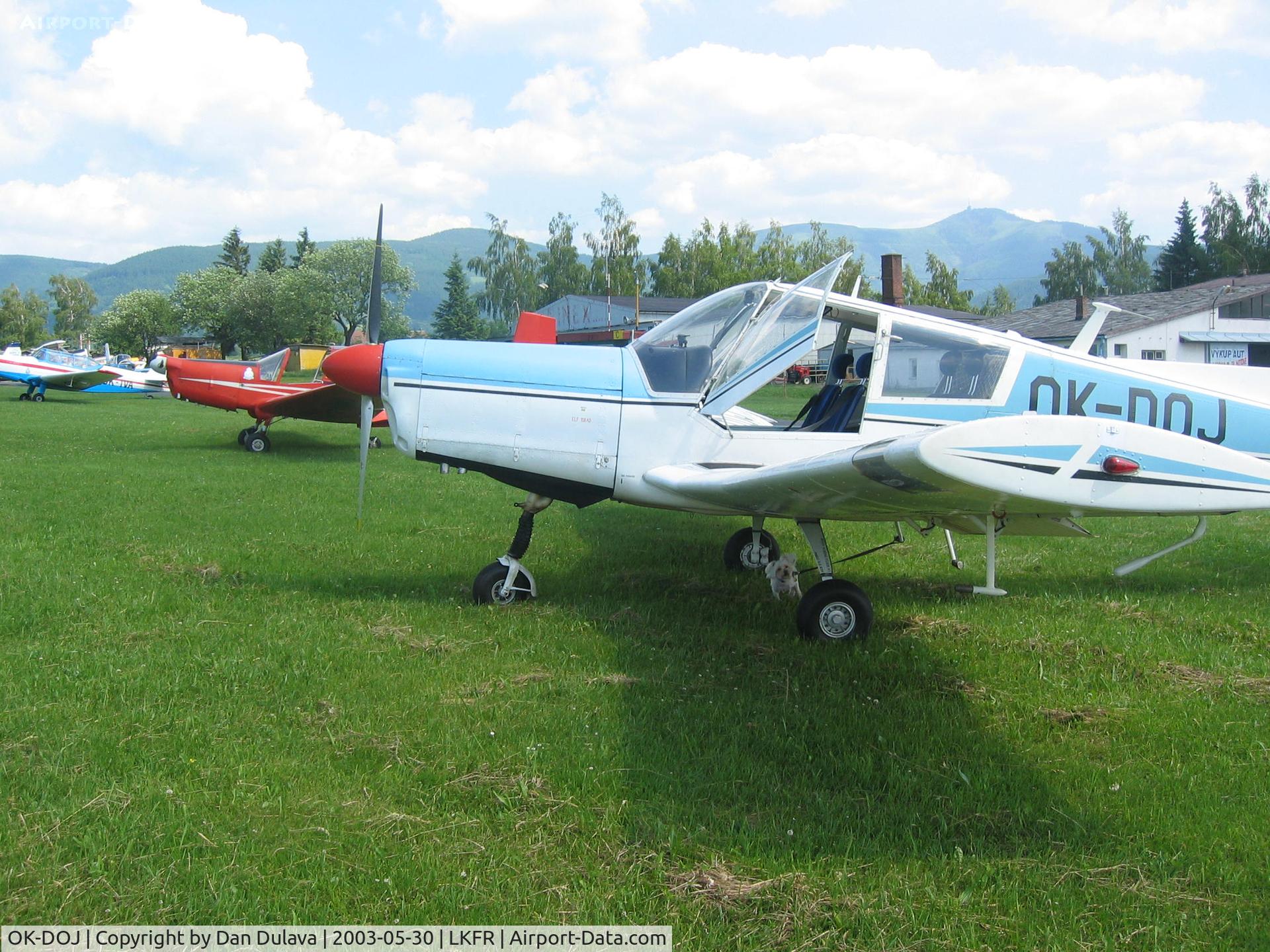 OK-DOJ, Zlin Z-43 C/N 0036, Nice view of Zlins lined up at Frydlant airport with OK-DOJ providing a cooling shade for little Duke.