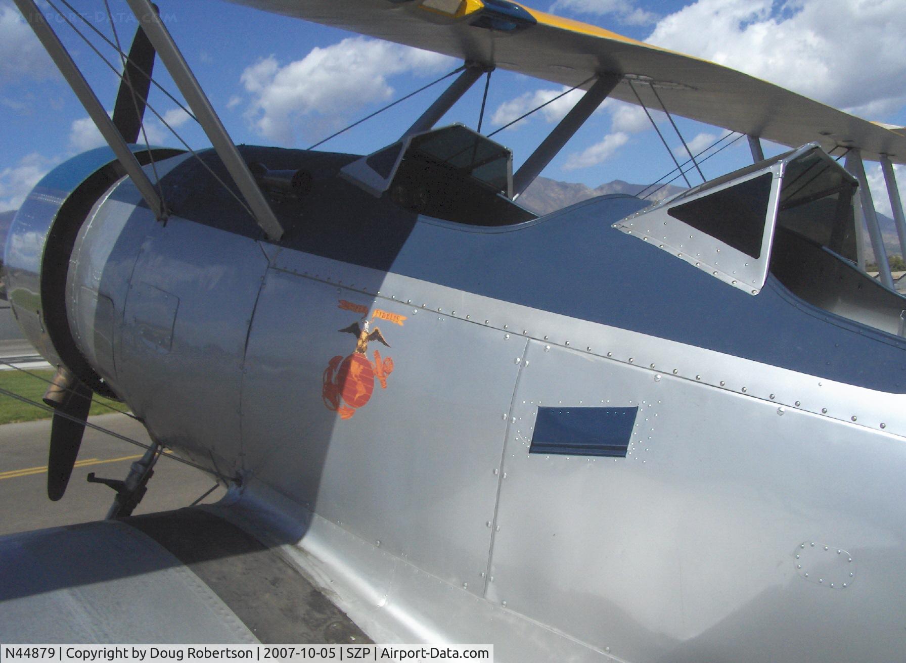 N44879, 1940 Naval Aircraft Factory N3N-3 C/N 4425, 1940 Naval Aircraft Factory N3N-3 'Yellow Peril', Lycoming R680 300 Hp upgrade, USN design primary trainer, versions built 1936-1941 totalled 995, US Marine Corps logo and spring-hinged flush footstep