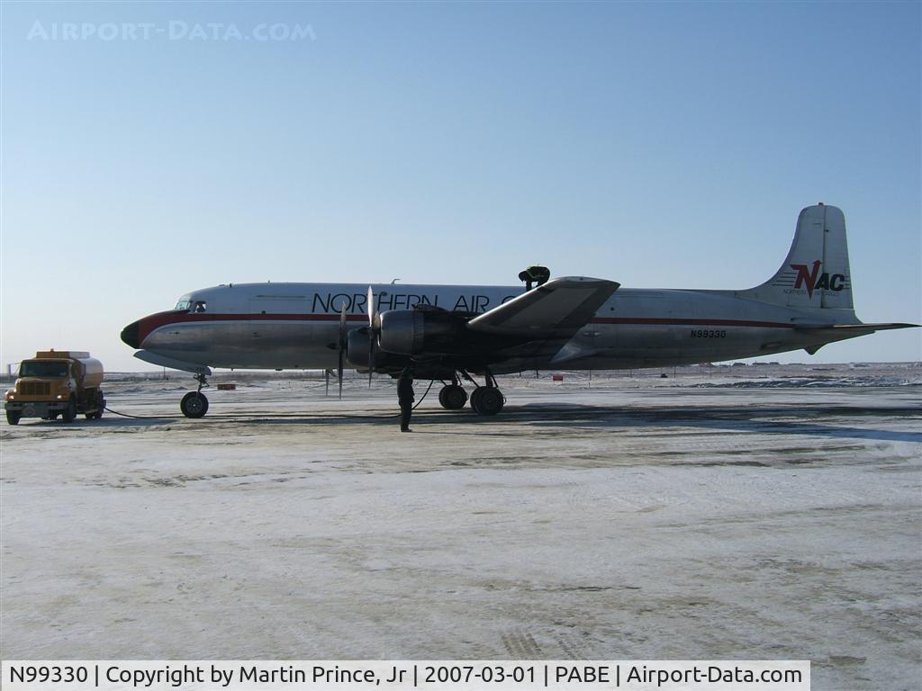 N99330, 1952 Douglas C-118A Liftmaster (DC-6A) C/N 43576, Northern Air Cargo on a cold winters day