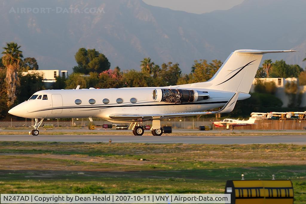 N247AD, Gulfstream Aerospace G-II(SP) C/N 208, This Gulfstream G-II(SP) is crossing RWY 16R to go to the bizjet run-up area to conduct some tests on the engines, which are uncowled.
