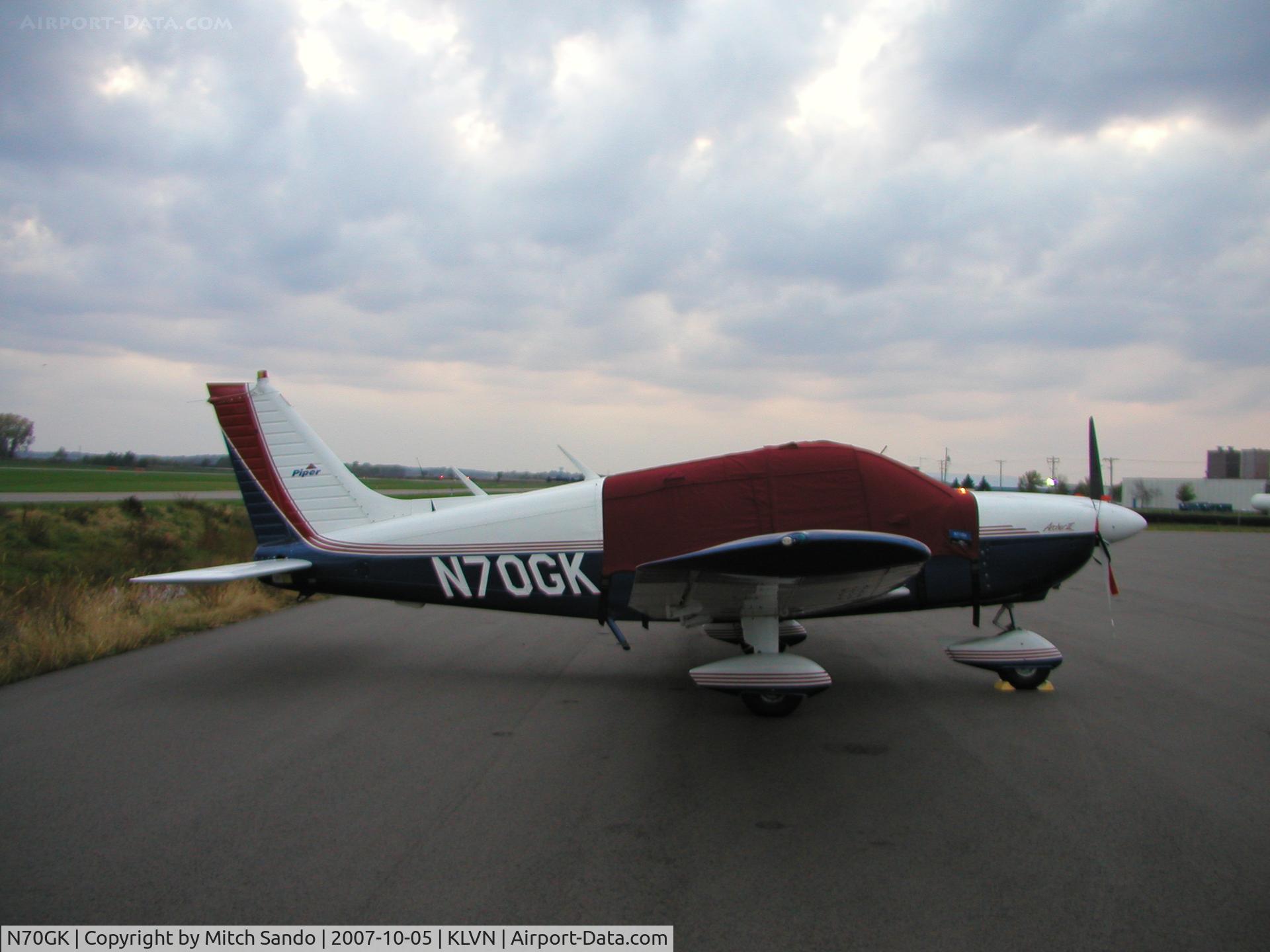 N70GK, 1977 Piper PA-28-181 C/N 28-7790590, Parked on the ramp at Airlake after a flight from Omaha, NE (MLE).
