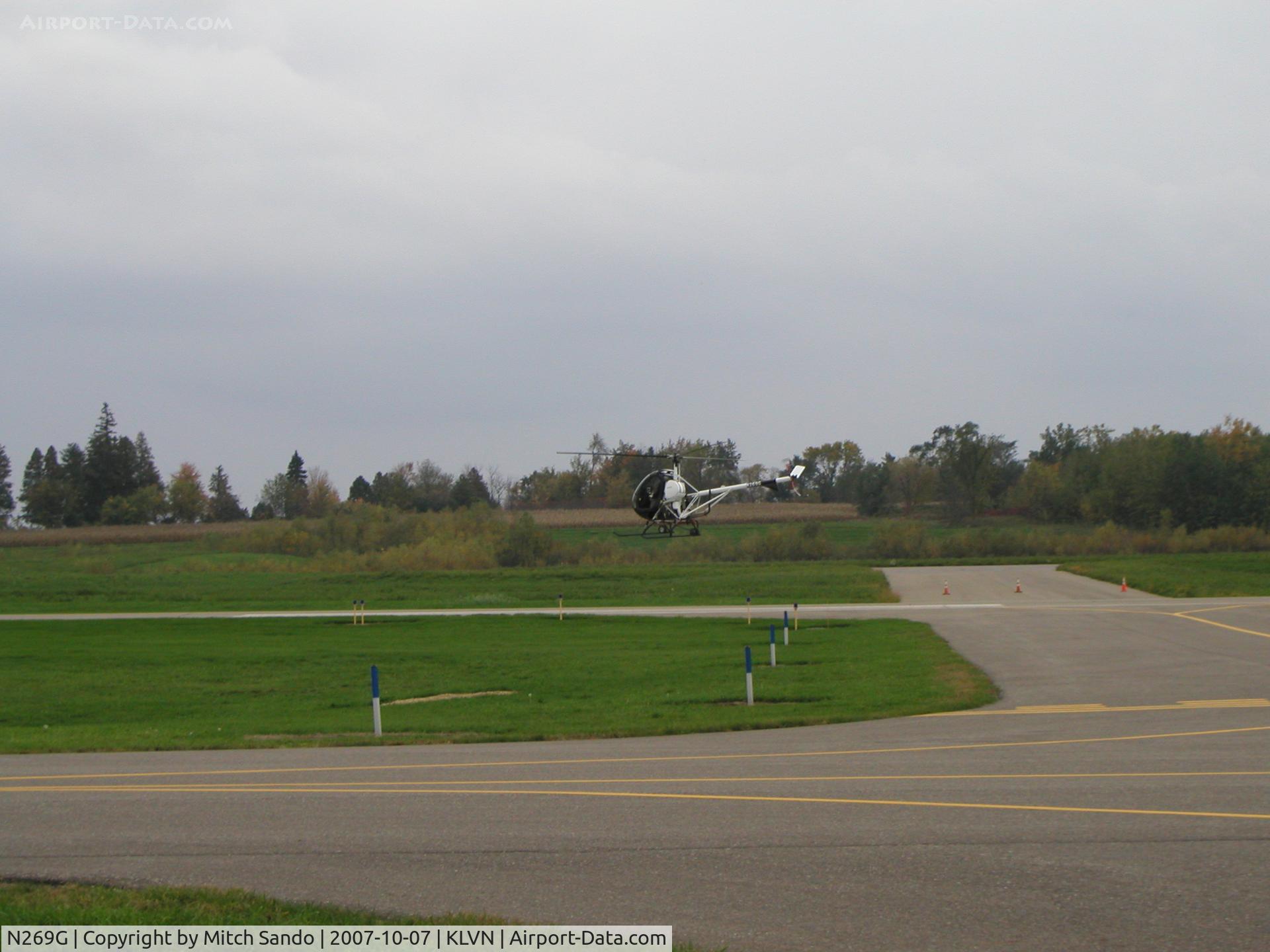 N269G, 2006 Schweizer 269C-1 C/N 0268, Practicing hovering maneuvers south of Runway 12.