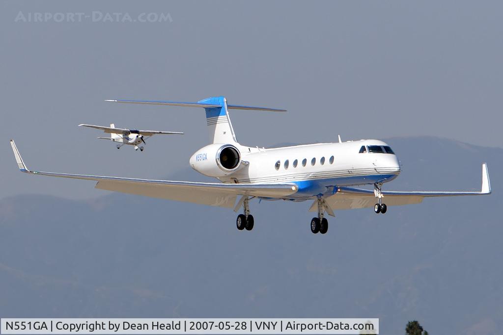 N551GA, 2000 Gulfstream Aerospace G-V C/N 606, Views like this are not uncommon at Van Nuys Airport since it is the busiest GA airport in the country.  Seen here is Amgen Corporation's 2000 Gulfstream G-V N551GA on final approach to RWY 16R, with a Cessna 172 on approach to RWY 16L.