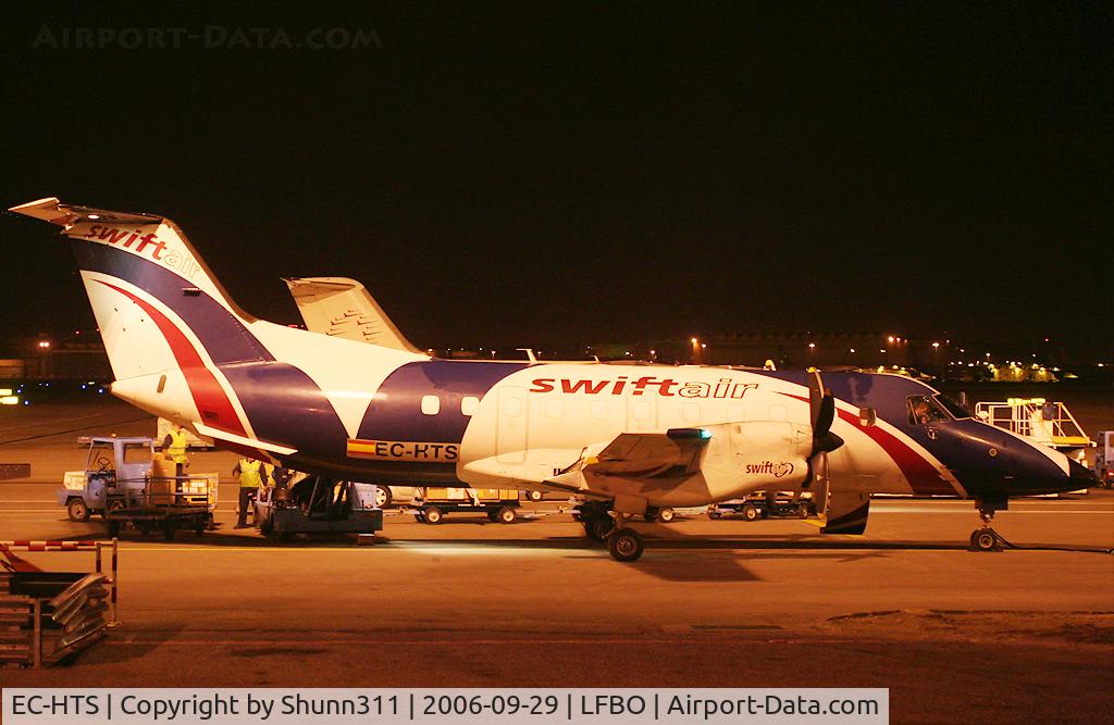 EC-HTS, 1989 Embraer EMB-120ER Brasilia C/N 120168, Taken during his work on the cargo apron...