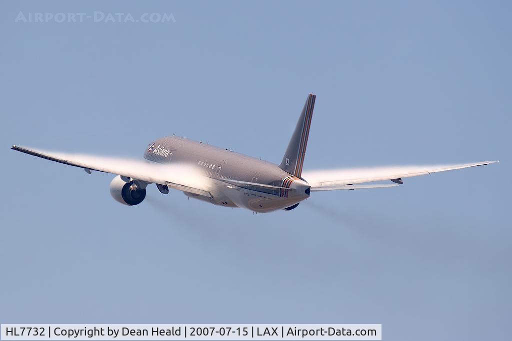 HL7732, 2004 Boeing 777-28E/ER C/N 29174, Asiana Airlines HL7732 (FLT AAR201) climbing out from RWY 25L (with nice condensation on the wings) enroute to Seoul, South Korea.