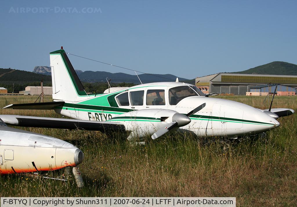 F-BTYQ, Piper PA-23-250 Aztec C/N 27-7304972, Parked in the grass... probably stored
