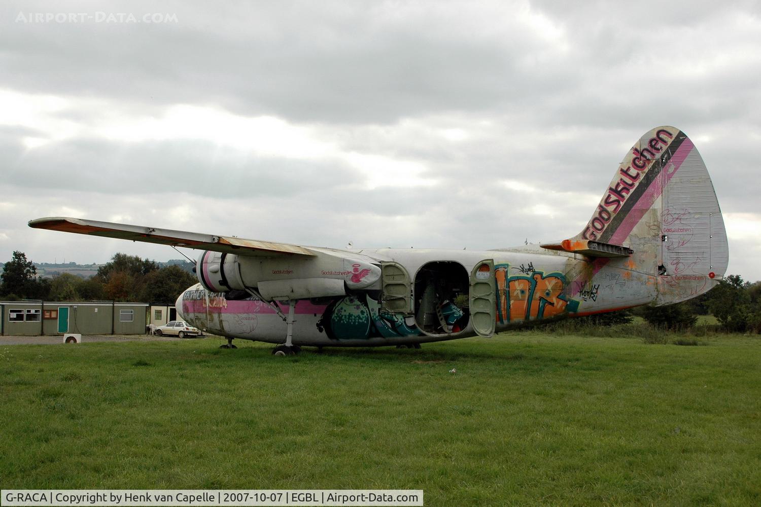 G-RACA, 1952 Percival P-57 Sea Prince T1 C/N P57/49, Falling apart: this Sea Prince is now sort of a gate guard at Long Marston, with the Gods Kitchen paint job apparantly the result of a music festival.