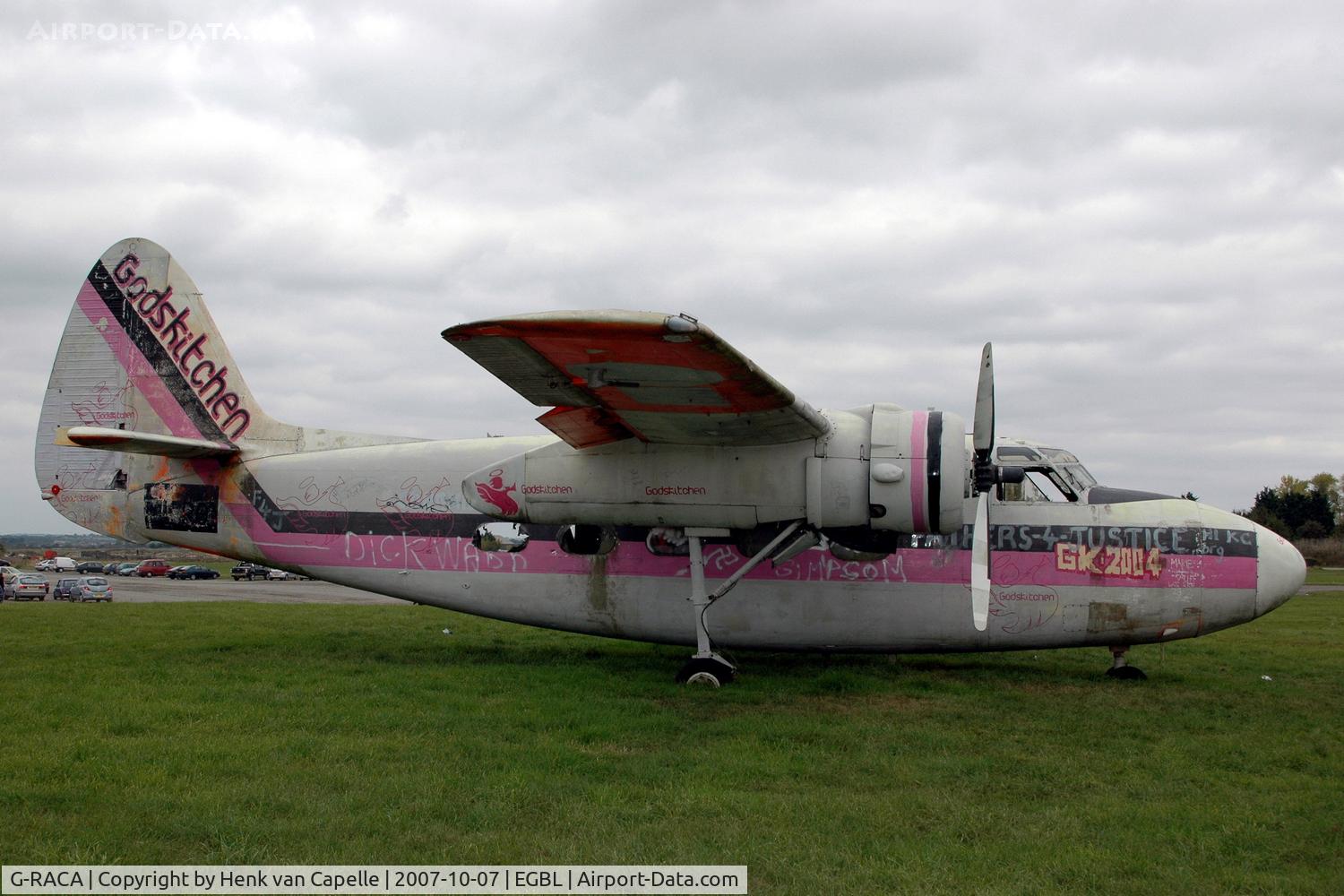 G-RACA, 1952 Percival P-57 Sea Prince T1 C/N P57/49, Falling apart: this Sea Prince is now sort of a gate guard at Long Marston, with the Gods Kitchen paint job apparantly the result of a music festival.