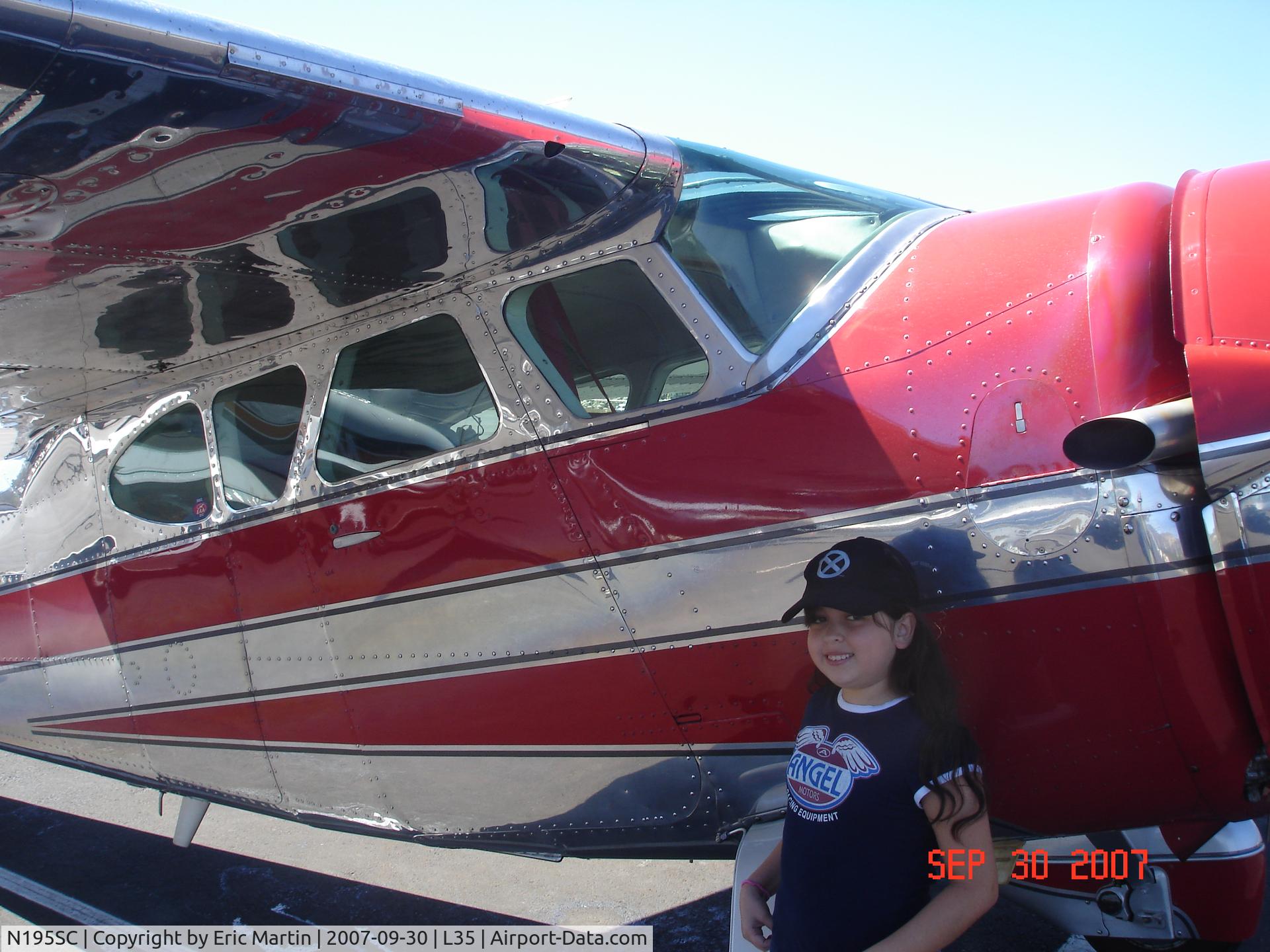 N195SC, 1949 Cessna 195 C/N 7402, Sammi posing with a beautiful 195