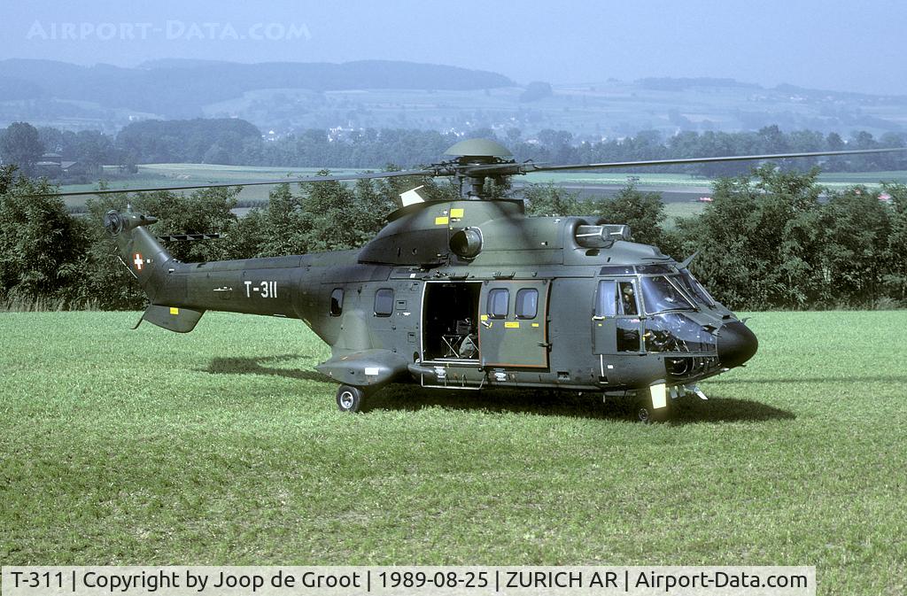 T-311, 1987 Aerospatiale TH89 Super Puma (AS-332M1) C/N 2216, This Super Puma transported us to a make shift targeting range in the ZÃ¼rch area. The targets which can be seen in the background were attacked by Hunter fighter bombers.