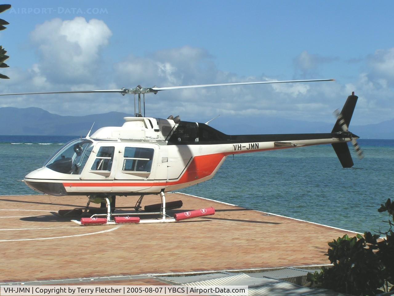 VH-JMN, 1974 Bell 206B JetRanger II C/N 1353, Bell 206B landing tourists at Green Island , offshore from Cairns