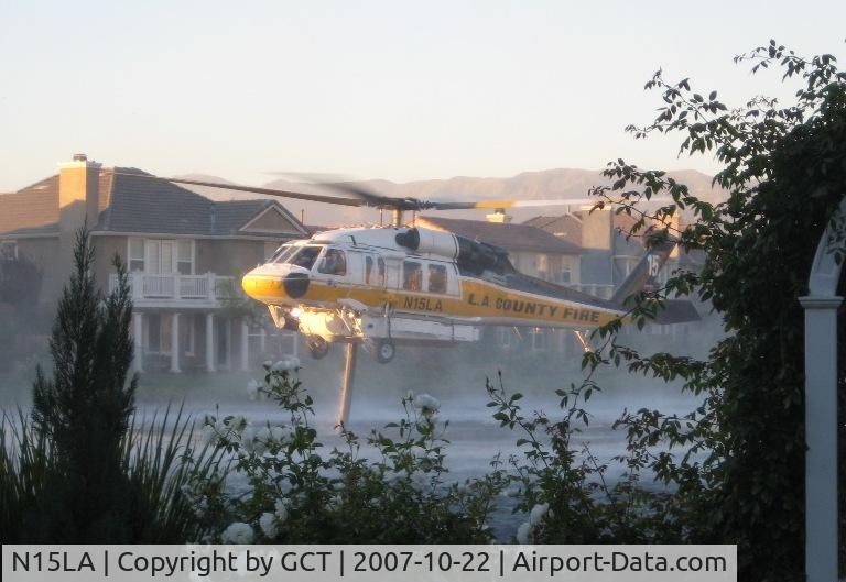 N15LA, 2004 Sikorsky S-70A Firehawk C/N 702846, Scooping up water in Valencia CA