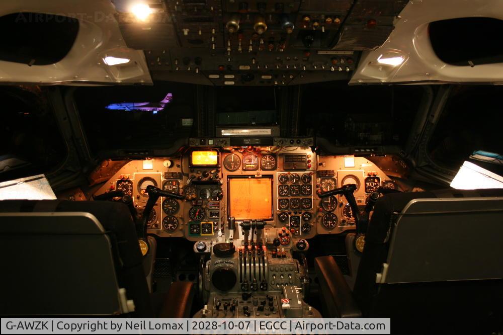 G-AWZK, 1971 Hawker Siddeley HS-121 Trident 3B-101 C/N 2312, Night shot of the flightdeck,note Concorde G-BOAC floodlit.