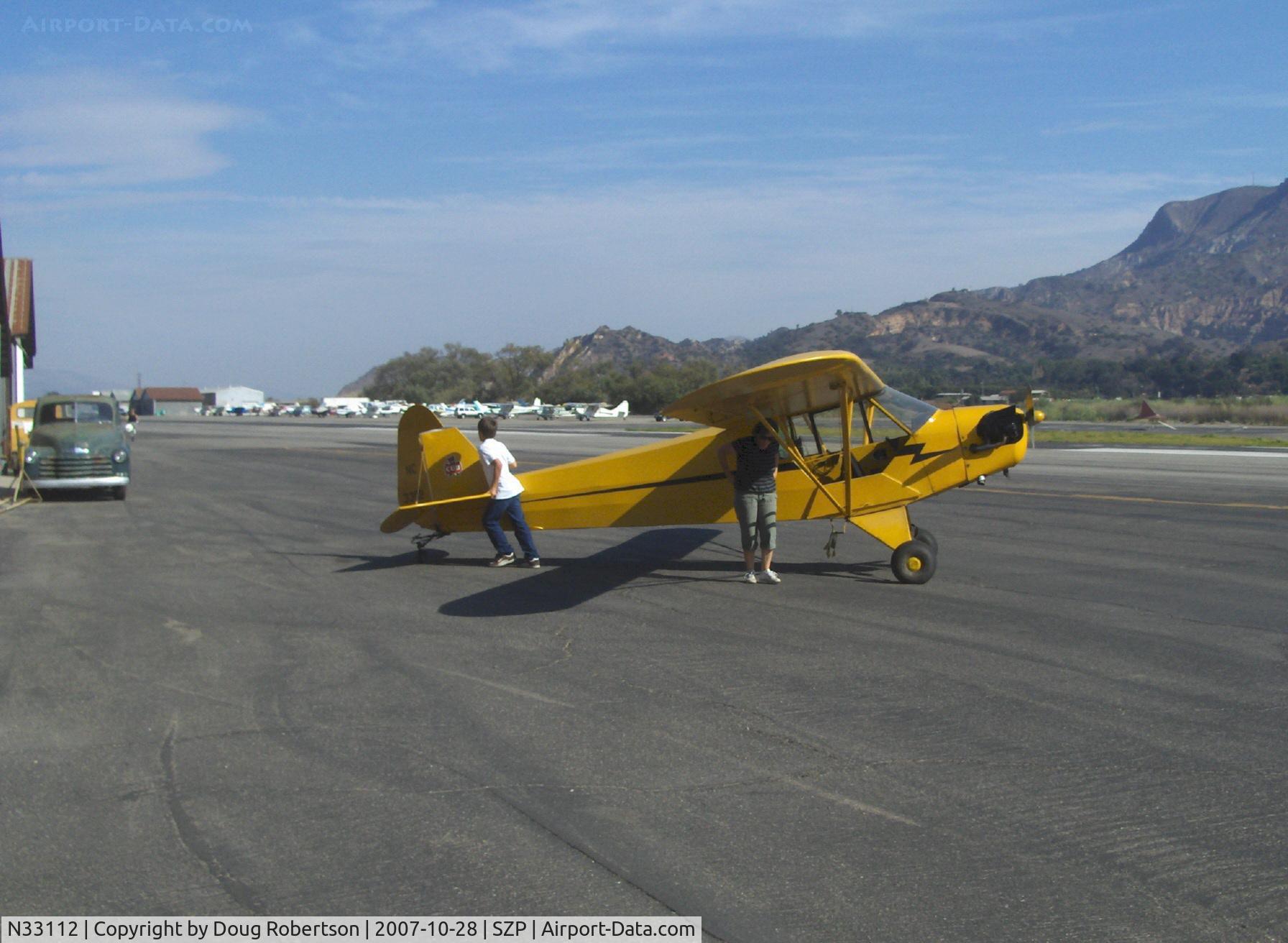 N33112, 1940 Piper J3C-65 Cub Cub C/N 5830, 1940 Piper J3C-65 CUB, Continental C90 90 Hp upgrade, Mom & son returning from a flight