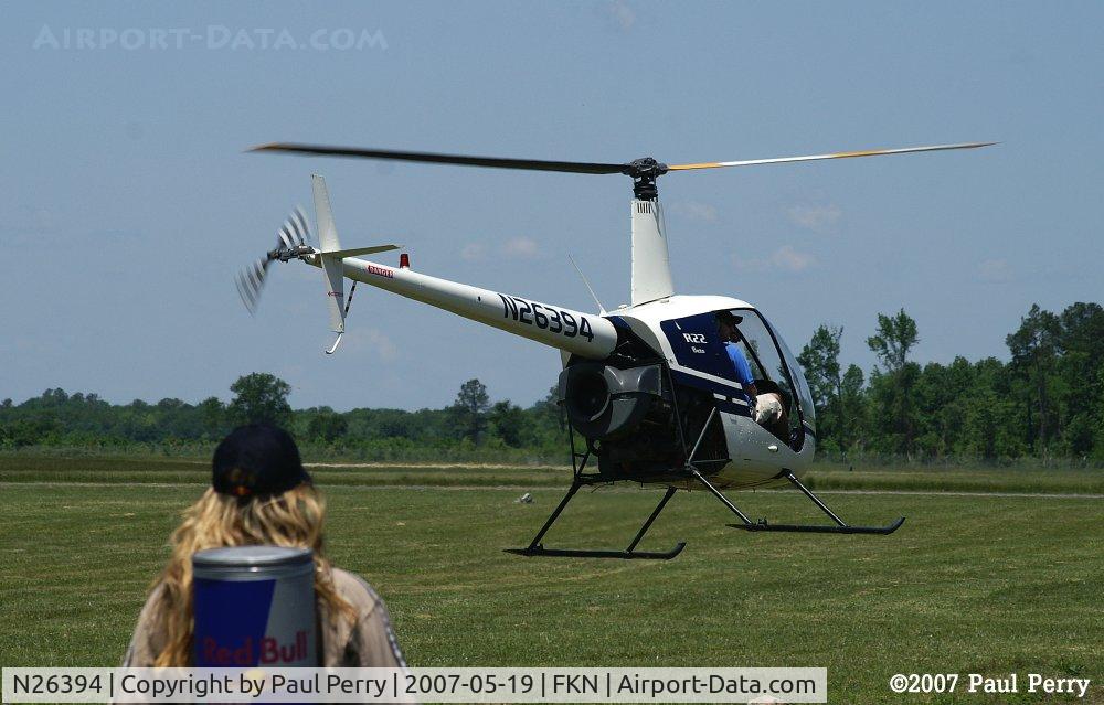 N26394, 1988 Robinson R22 Beta C/N 0833, Leaving, and with an audience